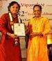 Ghatam Giridhar Udupa receiving award from Dr.M.Balamuralikrishna