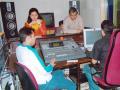 Ashok Bellare as a producer and music director in a studio recording