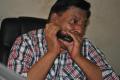 Ashok Bhandari playing Harmonica