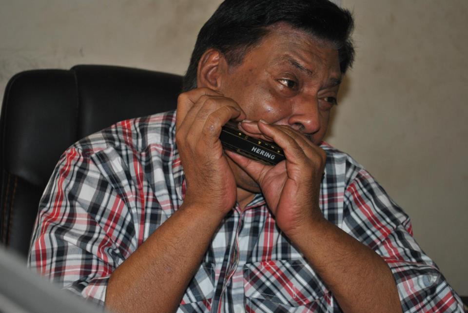 Ashok Bhandari playing Harmonica