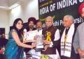Payal Ramchandani Kuchipudi dancer receiving award.