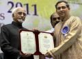 Anand Bhate receiving Award.
