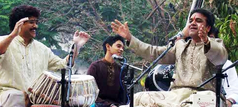 Dr. Ram Deshpande performing in program.