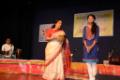 Shubha Joshi felicitating a student.