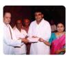 Jeyaraaj and Jaysri receiving award.