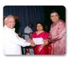 Jeyaraaj and Jaysri receiving award.
