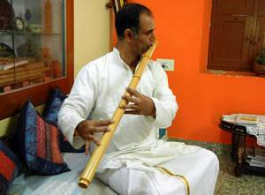 Ravishankar Mishra playing Indian bamboo flute.