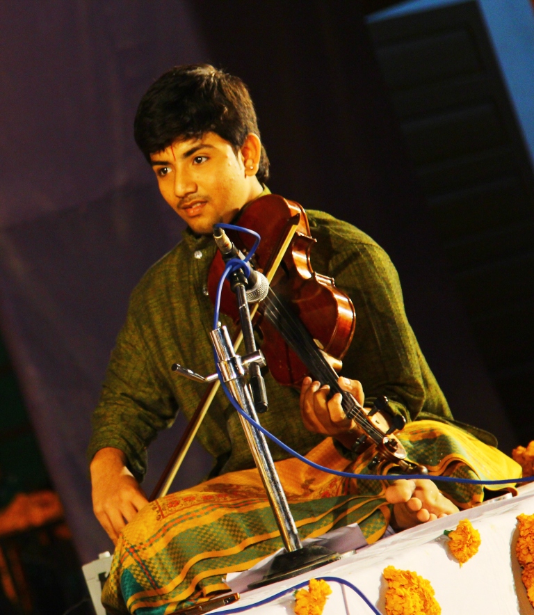 B. Ananth Raman performing in concert