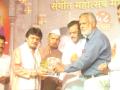 Rajendra Doorkar receiving award