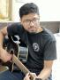 Parijat Kalikar Plying Gitar