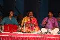 Playing Nattuvangm during the performance
