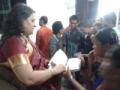 Amita giving autograph to her fans