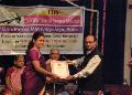 Arati Thakur-Kundalkar receiving Pt. Ramkrishnabua Vaze Yuva Puraskar from Shri. Mukund Sangoram